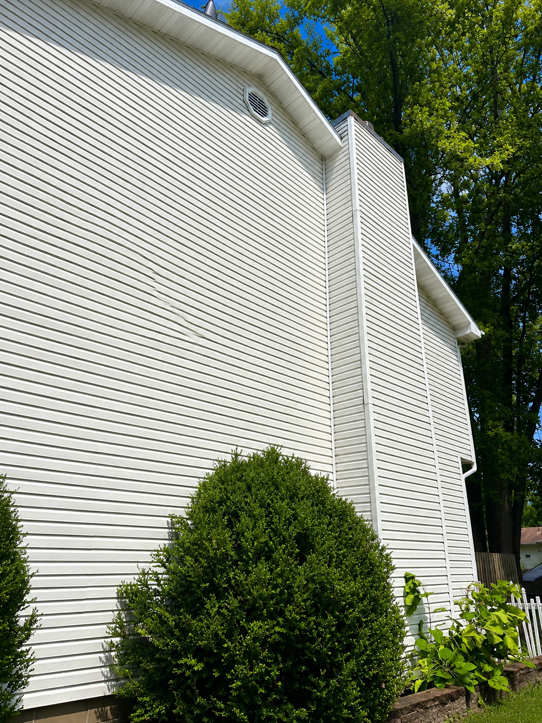 Bright white siding after professional exterior cleaning